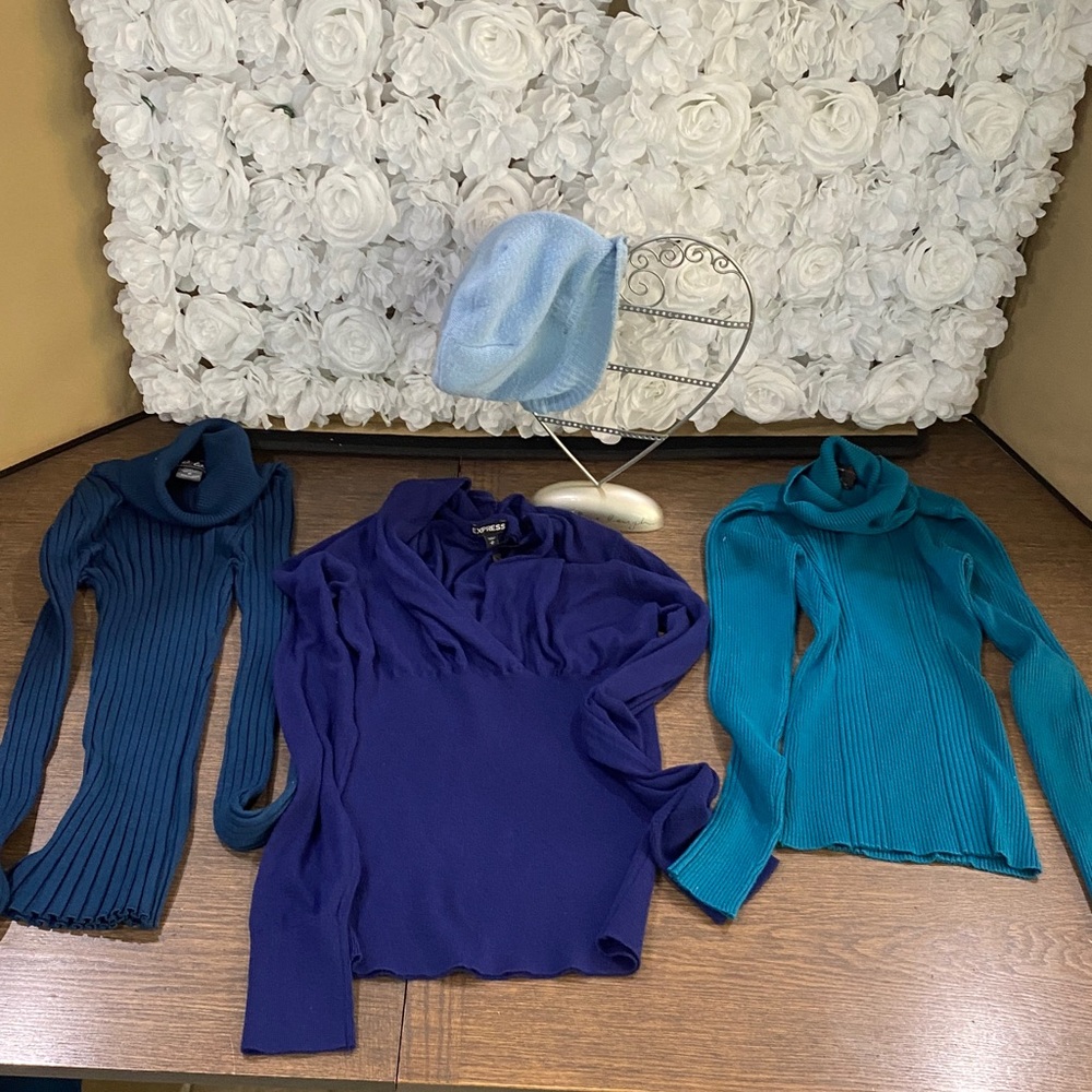 Blue sweater and blue turtleneck also included a blue beanie.